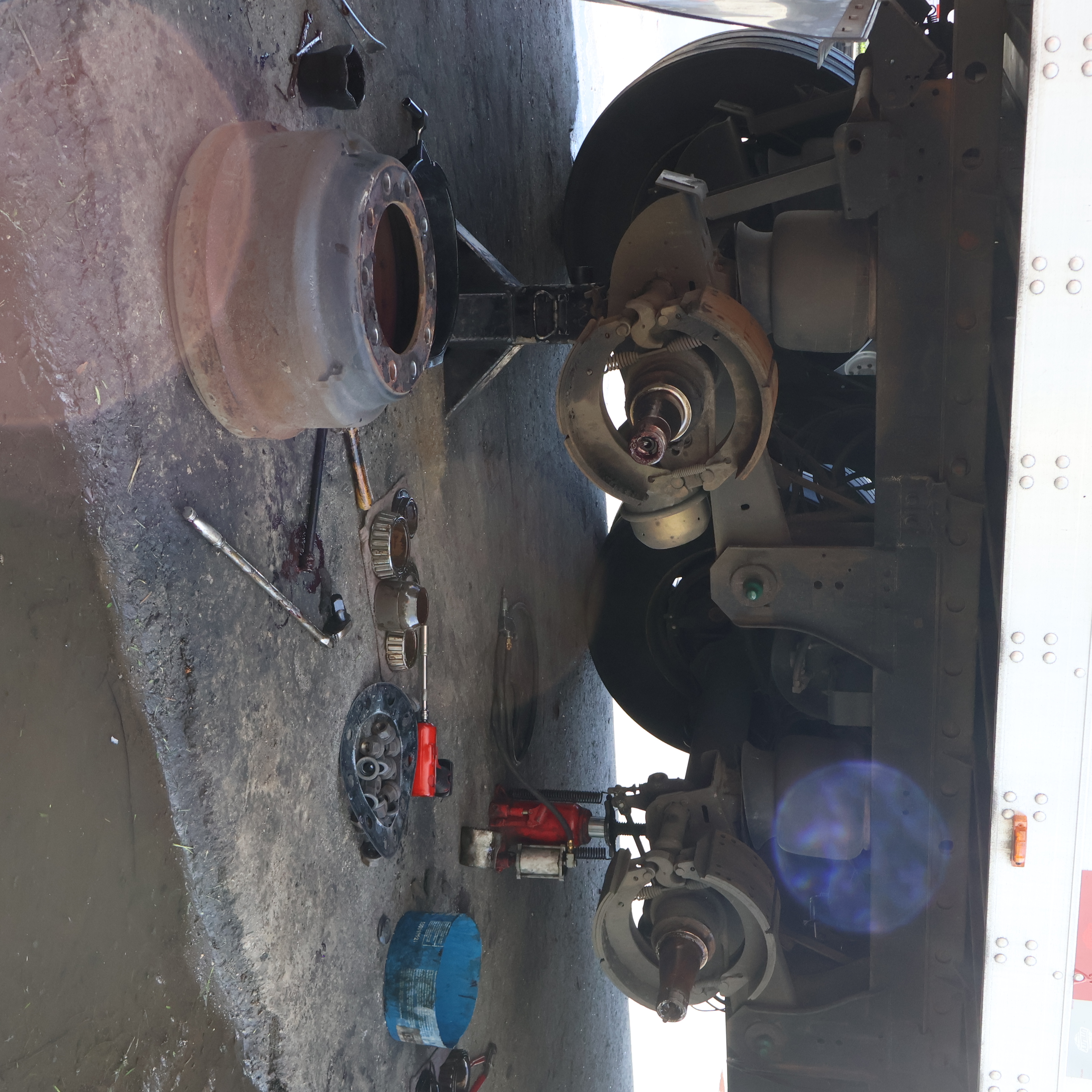Truck axle and brake components during semi truck repair